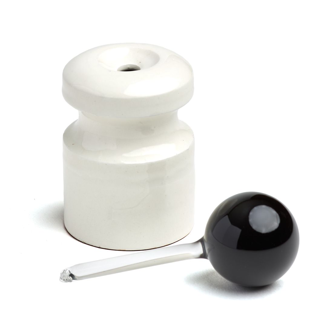 The open Caledonian Pear ceramic base beside its borosilicate glass applicator, on white.